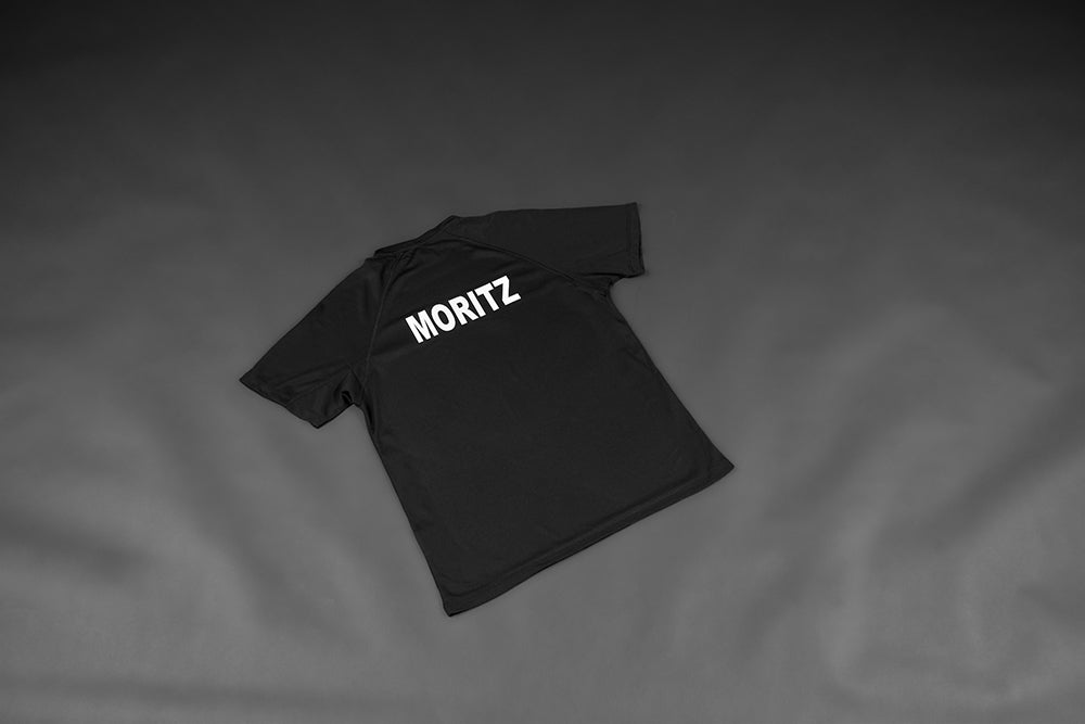 TUSLI teamline Shootingshirt Junior schwarz